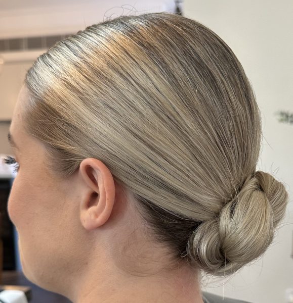 An elegant upstyle featuring soft twists and volume, perfect for special occasions and formal events in Newcastle.